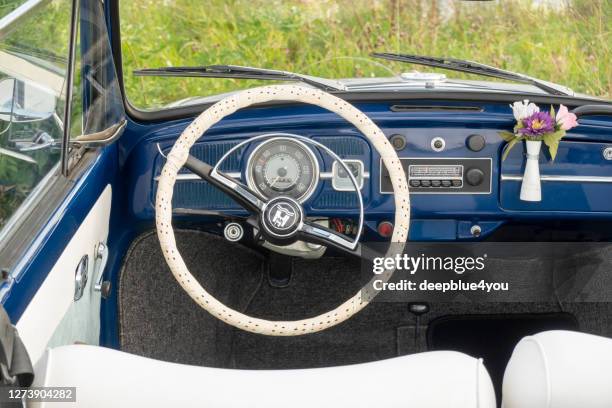 nice blue vw beetle convertible old-timer with open top, stands on the river bank - beetle car stock pictures, royalty-free photos & images