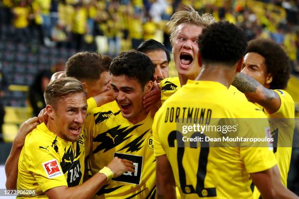 Giovanni Reyna of Borussia Dortmund celebrates scoring his teams first goal of the game with team mates Jude Bellingham, Felix Passlack, Erling...