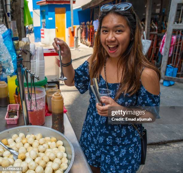 beautiful woman spotted strolling in divisoria market, manila, philippines - divisoria manila stock pictures, royalty-free photos & images