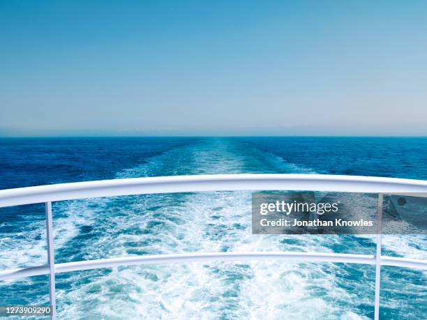view of ocean from cruise ship railing - imbarcazione per passeggeri foto e immagini stock