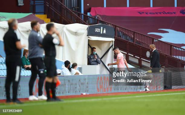 John Egan of Sheffield United leaves the field of play after receiving a red card following a VAR review during the Premier League match between...