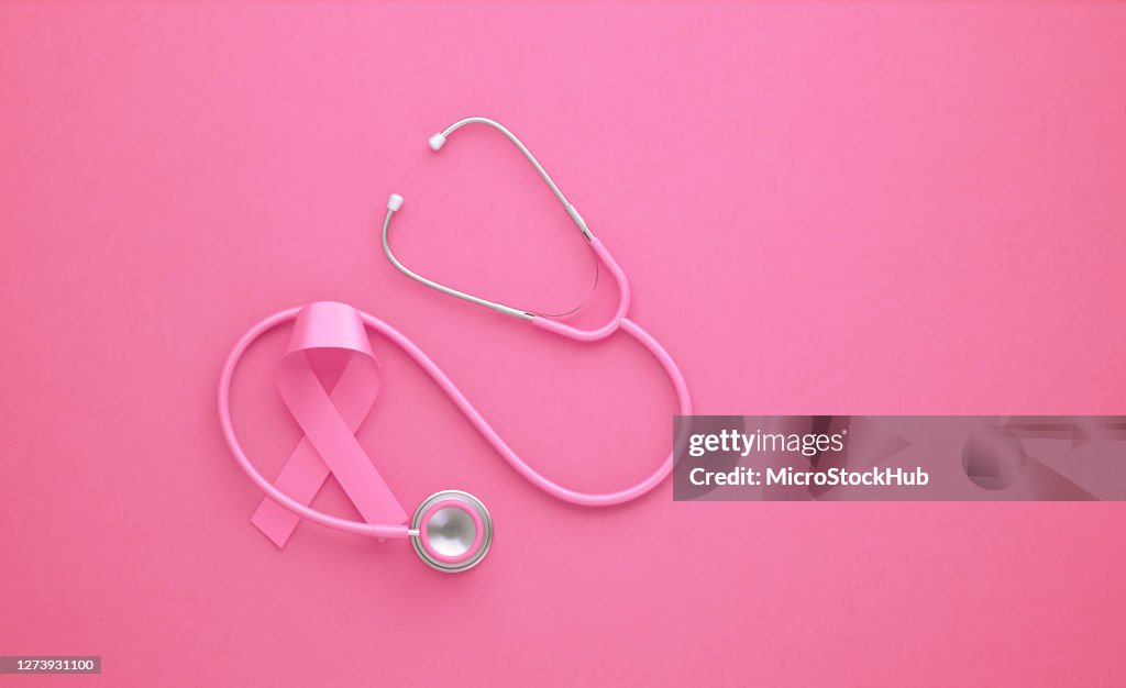 Pink Stethoscope and Pink Breast Cancer Awareness Ribbon on Pink Background