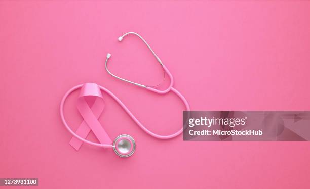 rosa stetoskop och rosa bröstcancer medvetenhet band på rosa bakgrund - mammografi bildbanksfoton och bilder