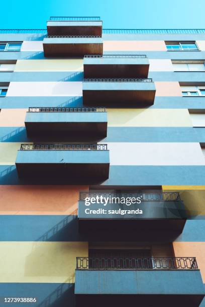 striped facade with balconies - asymmetry stock pictures, royalty-free photos & images