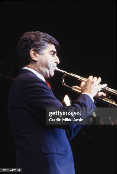 Governor Michael Dukakis plays trumpet at a campaign event in Boston in October, 1987.