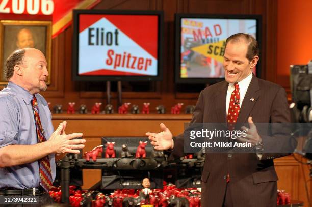 Eliot Spitzer talks with Jim Cramer, who hosts a television show on CNBC giving financial investment advice on February 1, 2006.
