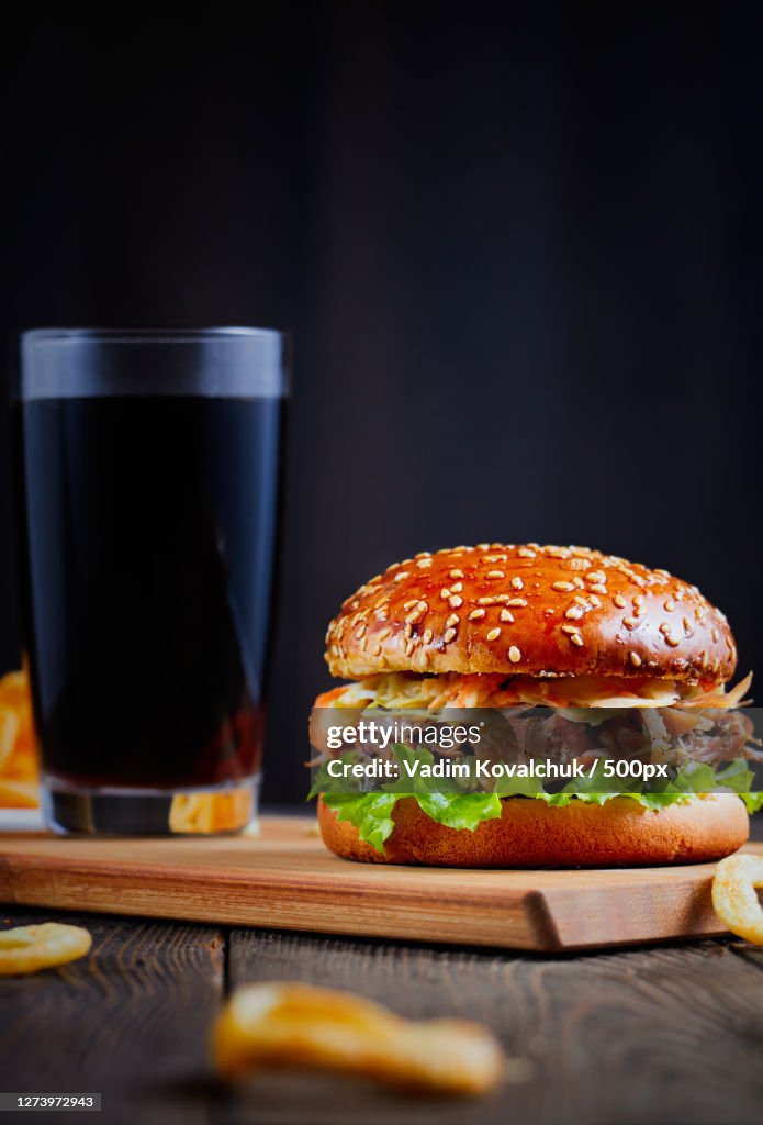 Close-up of burger and drink on table