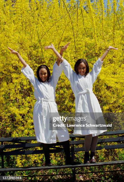 Tia and Tamera Mowry in a photoshoot in bathrobes for a promo in Central Park, NYC. April 14, 1999 exclusive