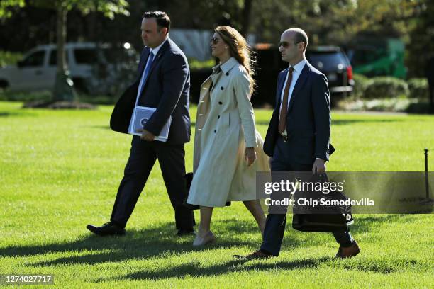 White House Deputy Chief of Staff Dan Scavino, Counselor to the President Hope Hicks and Senior Policy Advisor Stephen Miller walk across the South...