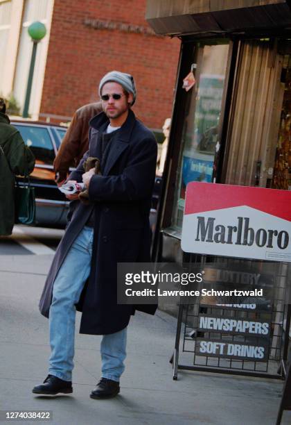 Bard Pitt spotted in a magazine shop on Lexington Avenue by photographers and is photographed leaving. December 11, 1995