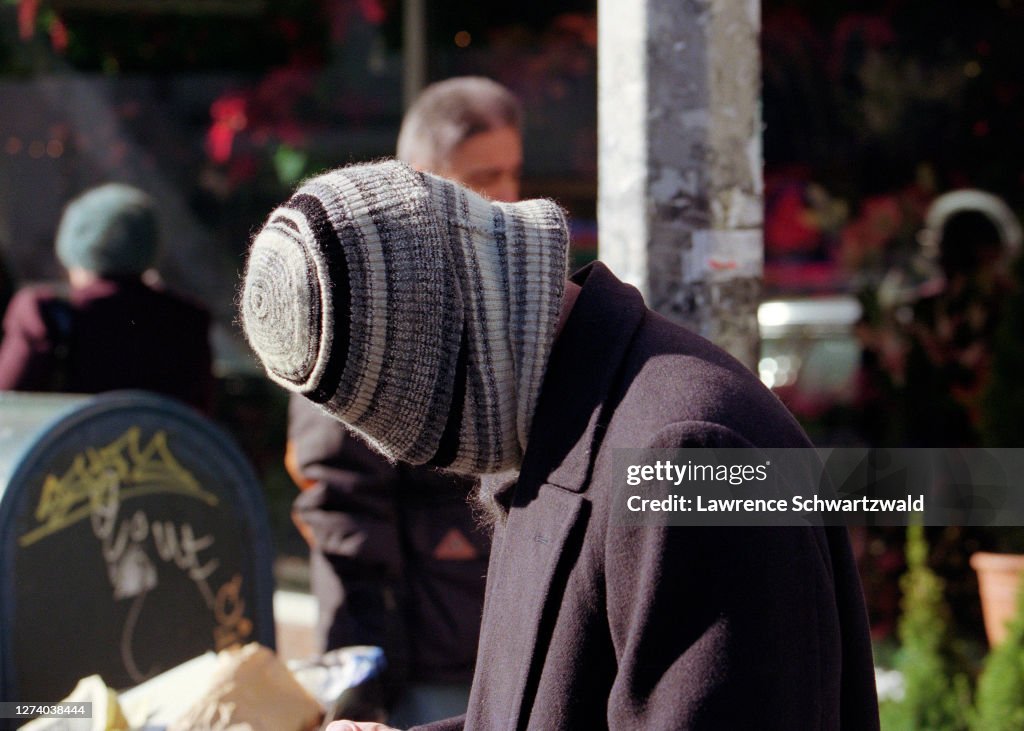 Brad Pitt Covers Face with Knit Cap in NYC