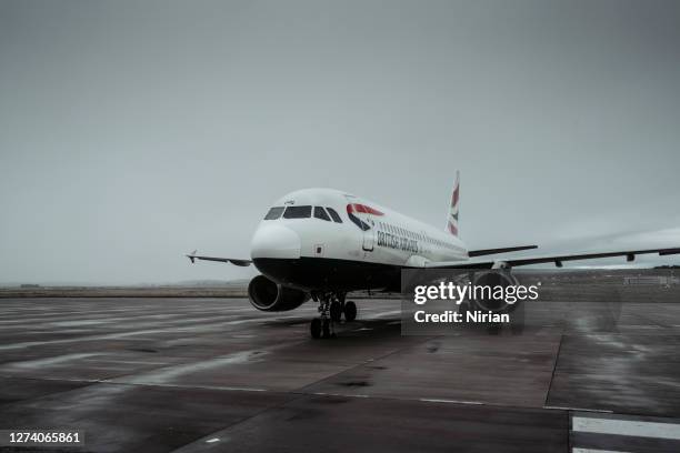 a british airways jet at inverness airport - airbus stock symbol stock pictures, royalty-free photos & images