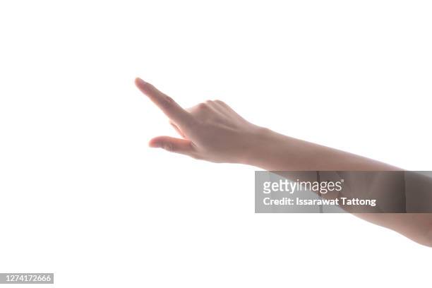 female's hand touching or pointing to something isolated on white background. close up. high resolution. - touching stock pictures, royalty-free photos & images