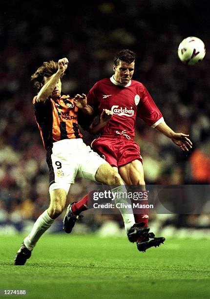 Stig Inge Bjornebye of Liverpool beats Josef Koslej of Kosice during the UEFA Cup first round second leg tie at Anfield in Liverpool, England....