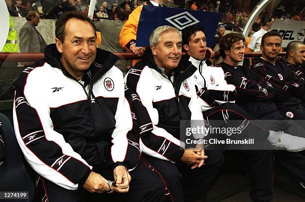 The Liverpool management team of Roy Evans and Gerard Houllier sit on the bench during the pre-season tournament match against St Patricks Athletic...
