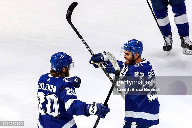 Kevin Shattenkirk of the Tampa Bay Lightning is congratulated by Blake Coleman after scoring a goal against the Dallas Stars during the first period...