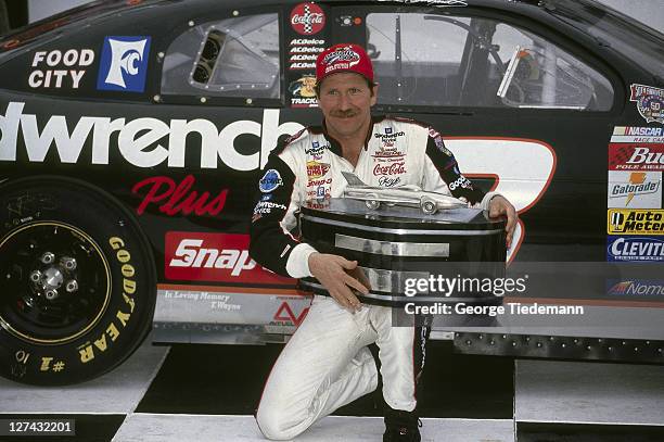 40th NASCAR Daytona 500: Closeup of Dale Earnhardt victorious with trophy in victory lane after winning race at Daytona International Speedway....