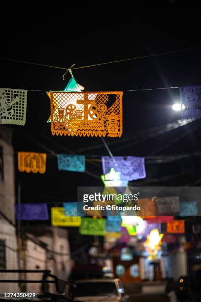 street with paper garlands decorations in the day of the dead in mexico - mexico city night stock pictures, royalty-free photos & images