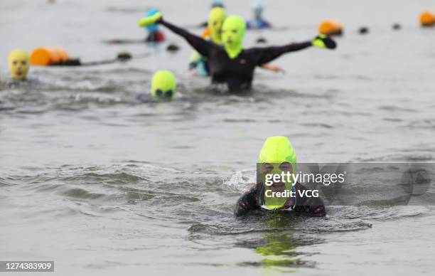 Citizens wearing facekinis are seen in the sea on September 14, 2020 in Qingdao, Shandong Province of China.