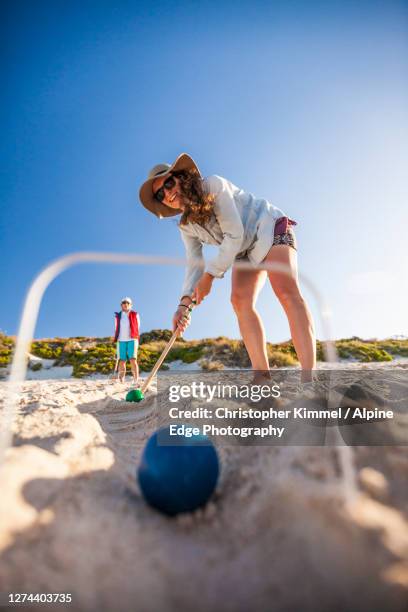 woman playing croquet on beach,rottnestisland, perth, western australia, australia - rottnest island stock pictures, royalty-free photos & images