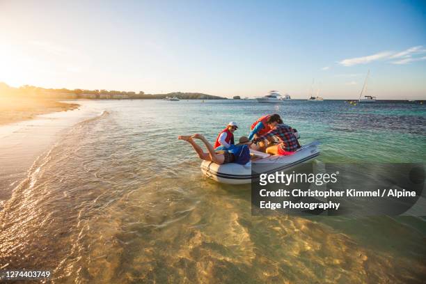 group of people on inflatable raft in sea, rottnestisland, perth, western australia, australia - rottnest island stock pictures, royalty-free photos & images