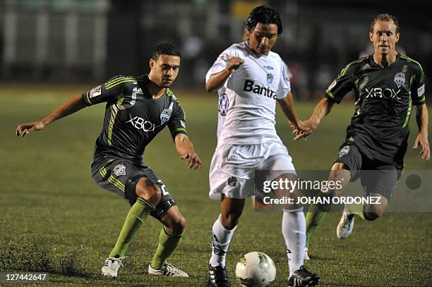 Dagoberto Arriola from Comunicaciones and Lamar Neagle of Seattle Sounders and Tyson Wahl fight for the ball during the Concacaf Championship League...