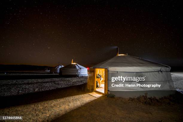illuminated yurts at night, khongor, mongolia - yurt stock pictures, royalty-free photos & images