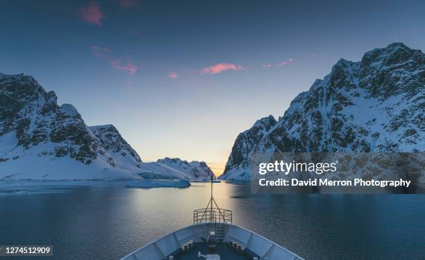 ship sunset cruise on the antarctic peninsula - exploration stock pictures, royalty-free photos & images