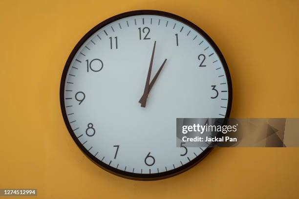 the concept of time - reloj de pared fotografías e imágenes de stock