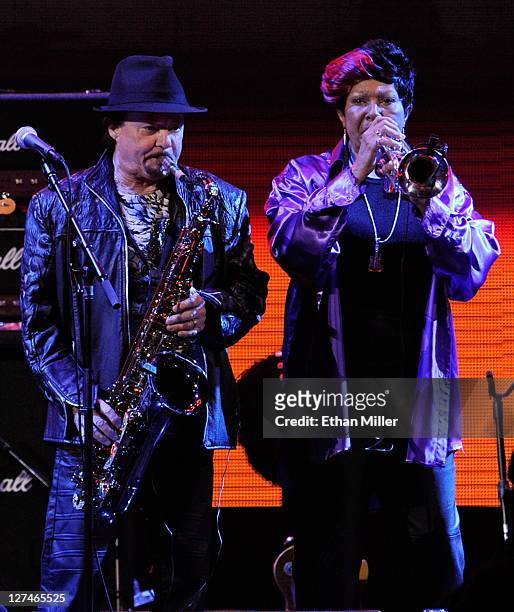 Saxophonist Jerry Martini and trumpet player Cynthia Robinson from The Family Stone perform with Steven Tyler at the iHeartRadio Music Festival at...