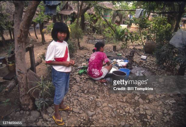 August 8: MANDATORY CREDIT Bill Tompkins/Getty Images Mother and daughter washing clothes. Pampanga is a province in the Central Luzon region of the...