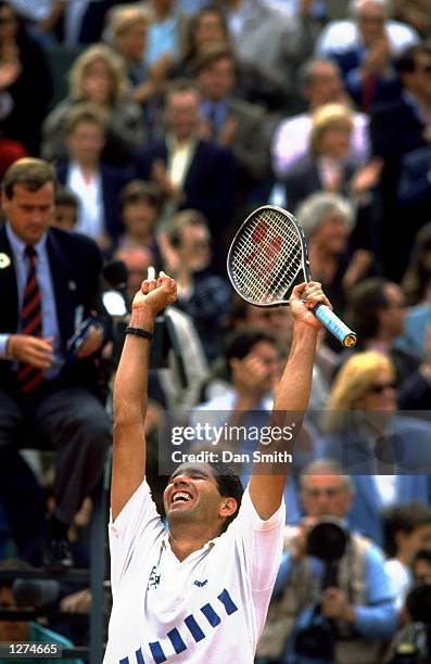 Andres Gomez of Ecuador punches the air in celebration after his victory in the Mens Singles final during the French Open at Roland Garros in Paris....