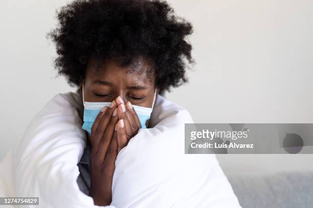 sick woman at home quarantine - symptom stock pictures, royalty-free photos & images