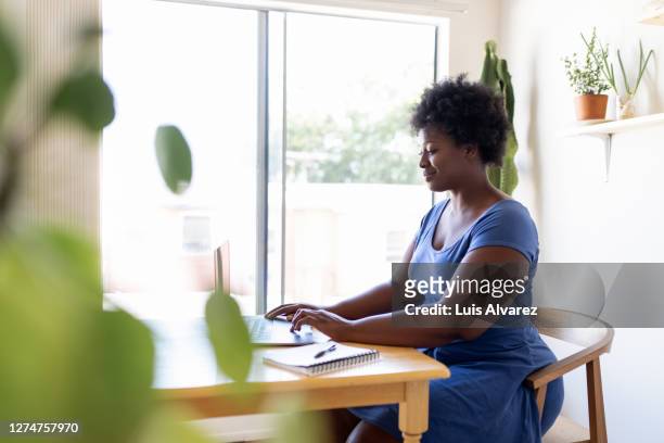 woman working from home during lockdown - large home stock pictures, royalty-free photos & images