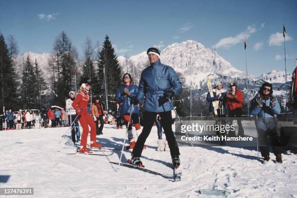English actor Roger Moore as 007 with American ice skating champion Lynn-Holly Johnson as Bibi Dahl in a scene from the James Bond film 'For Your...