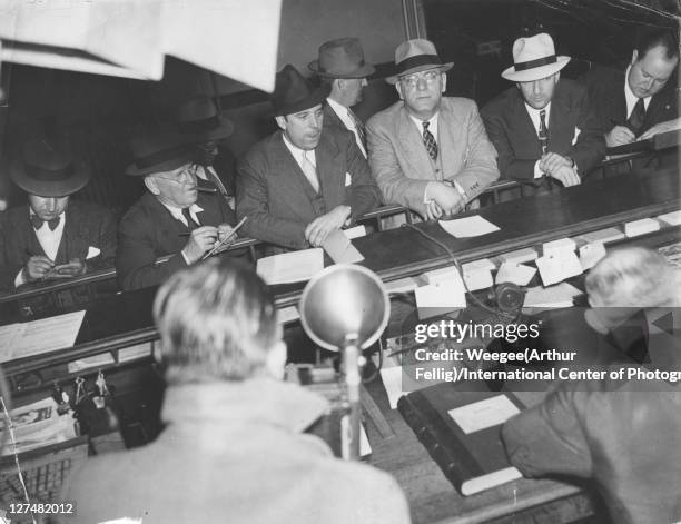 Surrounded by reporters, German-born American Fritz Kuhn , leader of the pro-Nazi German American Bund, stands at the desk in the New York City...