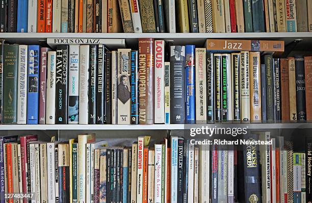 books on shelves - bookshelf stock pictures, royalty-free photos & images