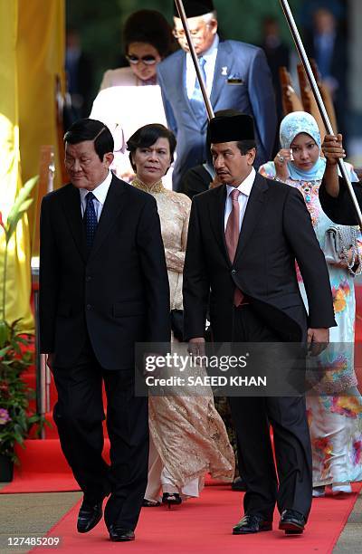 Malaysia King Sultan Mizan Zainal Abidin escorts Vietnamese President Truong Tan Sang during a welcoming ceremony at Parliament House in Kuala Lumpur...