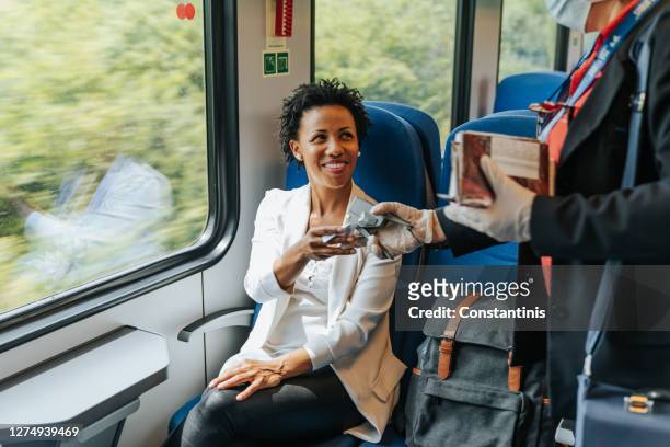 checking ticket - railroad conductor stock pictures, royalty-free photos & images