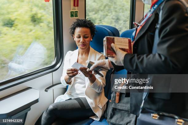 train ticket check - railroad conductor stock pictures, royalty-free photos & images