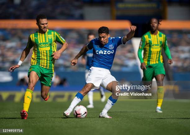 Allan of Everton and Kieran Gibbs of West Bromwich Albion in action during the Premier League match between Everton and West Bromwich Albion at...