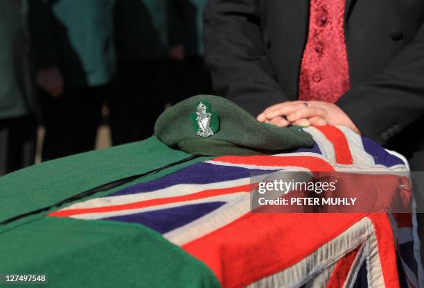 The coffin containing the remains of Gusty Spence, draped with the regimental flag of the Royal Ulster Rifles, is pictured following the funeral...