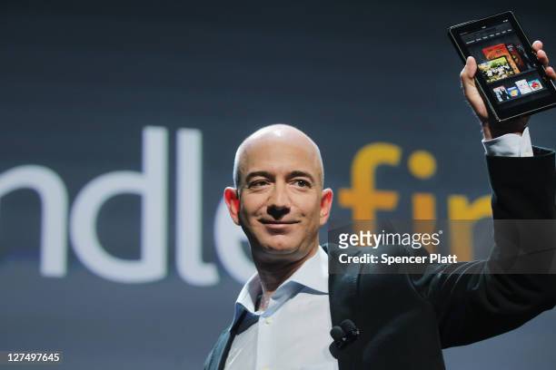 Amazon founder Jeff Bezos holds the new Amazon tablet called the Kindle Fire on September 28, 2011 in New York City. The Fire, which will be priced...