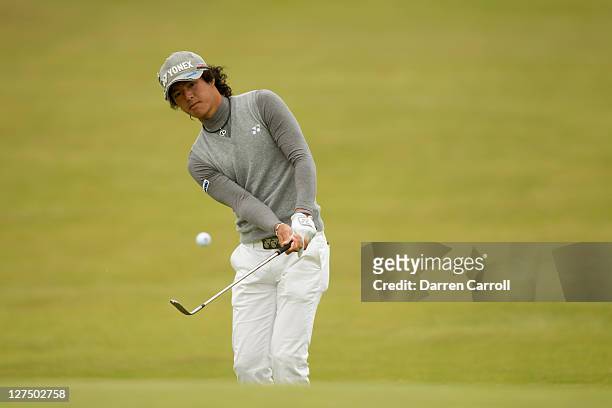 Ryo Ishikawa of Japan plays a shot during the first round of the 2011 Open Championship at Royal St. George's Golf Club in Sandwich, England on July...