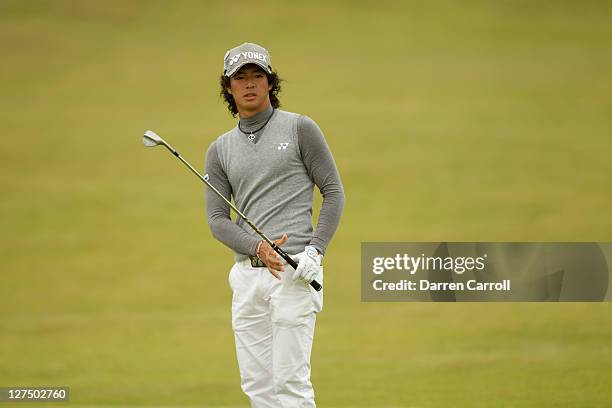 Ryo Ishikawa of Japan plays a shot during the first round of the 2011 Open Championship at Royal St. George's Golf Club in Sandwich, England on July...