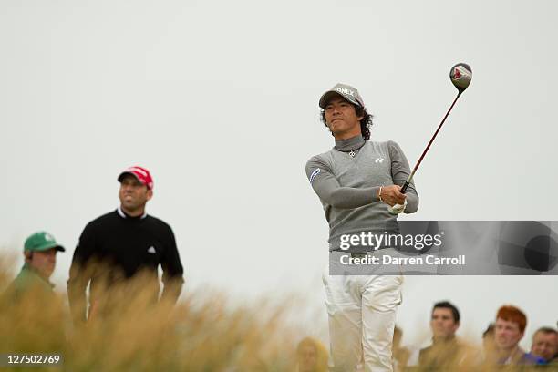 Ryo Ishikawa of Japan plays a shot during the first round of the 2011 Open Championship at Royal St. George's Golf Club in Sandwich, England on July...