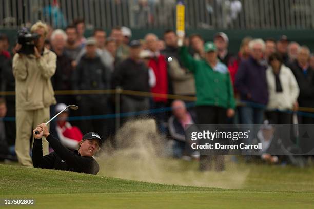 Phil Mickelson plays a shot during the first round of the 2011 Open Championship at Royal St. George's Golf Club in Sandwich, England on July 14,...