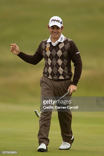 Louis Oostuizen of South Africa reacts to a putt during the first round of the 2011 Open Championship at Royal St. George's Golf Club in Sandwich,...
