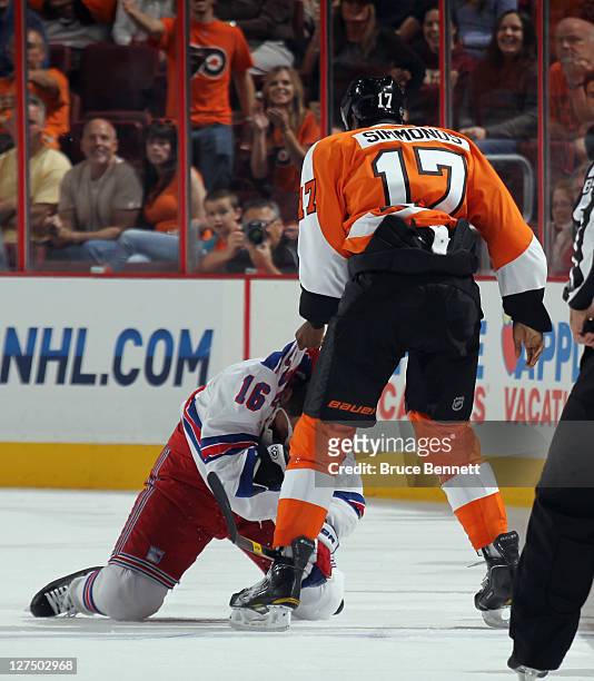 Wayne Simmonds of the Philadelphia Flyers attempts to fight with Sean Avery of the New York Rangers during an NHL preseason game at Wells Fargo...