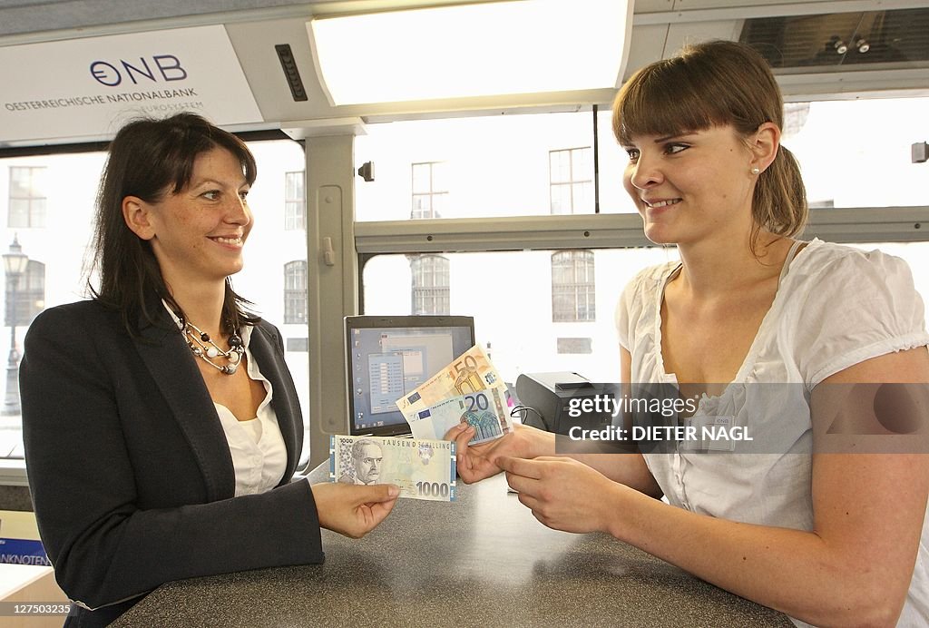 A woman exchanges Austrian Schillings fo